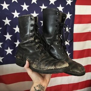 Distressed vintage black combat boots